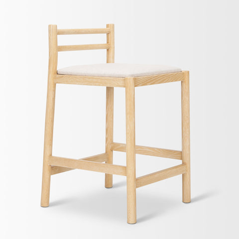 Wooden bar stool with a white cushion on a light gray background