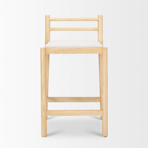 Wooden bar stool with a white cushion on a light gray background