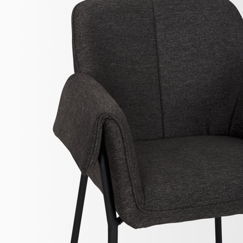 Dark gray upholstered chair with armrest on a white background