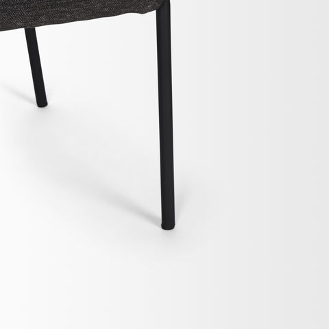 Close-up of a black chair leg on a white background