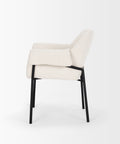White upholstered chair with black legs on a white background