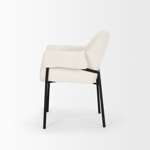 White upholstered chair with black legs on a white background