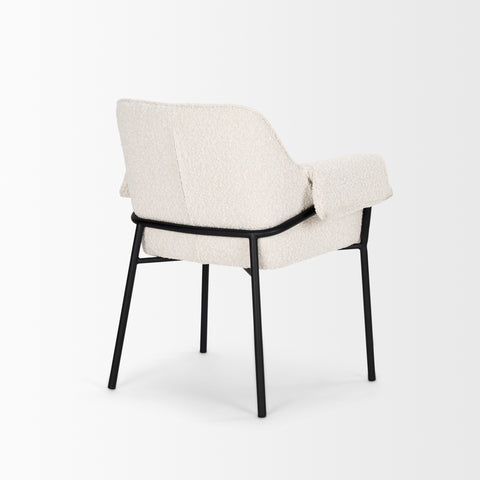 White upholstered chair with black metal frame on a white background