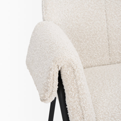 Close-up of a textured white chair with a black base on a white background