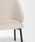 Beige chair with black legs on a white background