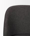 Close-up of a dark gray upholstered chair on a white background