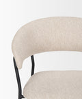 Close-up of a chair with beige upholstered backrest and seat on a white background