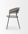 Modern chair with gray cushioned seat and backrest on a white background