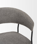 Gray upholstered chair with a white background