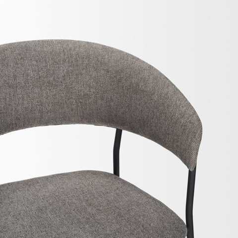 Gray upholstered chair with a white background