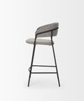 Bar stool with gray cushioned seat and backrest on a white background