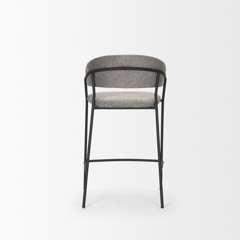 Bar stool with gray cushioned seat and backrest on a white background