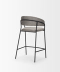 Bar stool with gray cushioned seat and backrest on a white background