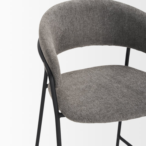 Gray upholstered chair with black metal frame on a white background