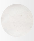 Round white stone on a light gray background