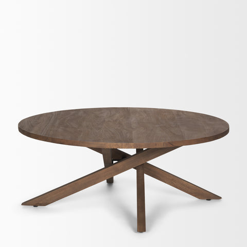 Round wooden table with a unique base design on a white background