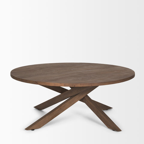 Round wooden table with a unique base design on a white background