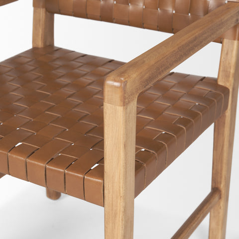 Brown woven chair with wooden frame on a white background