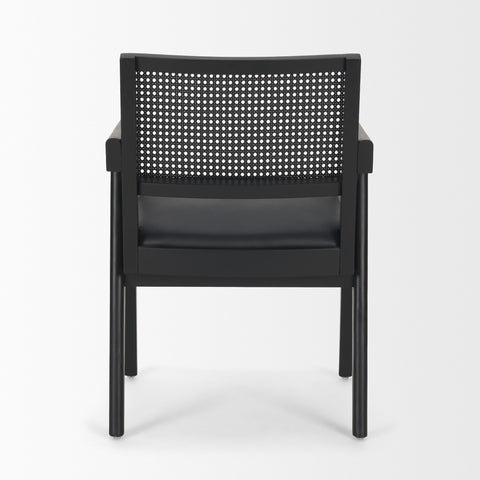 Black chair with woven backrest on a white background