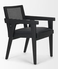 Black armchair with woven backrest on a white background