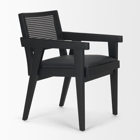 Black armchair with woven backrest on a white background