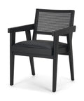 Black armchair with woven backrest on a white background