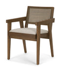 Wooden armchair with wicker backrest and beige cushion on a white background