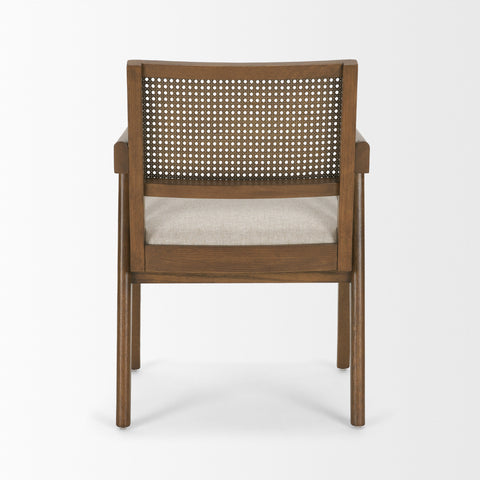 Wooden chair with wicker backrest and cushion on a white background