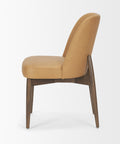 Tan upholstered chair with wooden legs on a white background