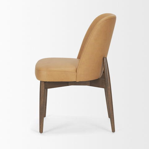 Tan upholstered chair with wooden legs on a white background