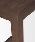 Close-up of a wooden table leg on a white background