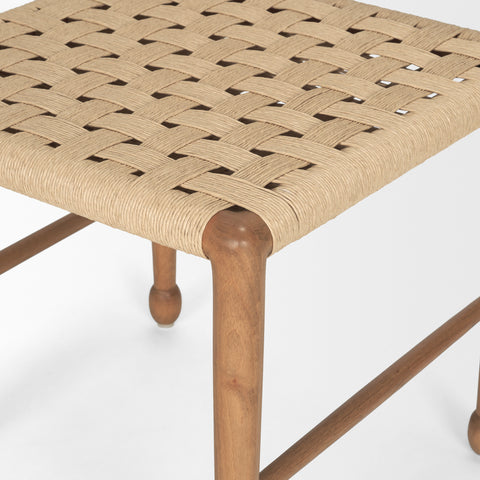 Woven stool with wooden legs on a white background