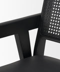Black office chair with perforated backrest on a white background
