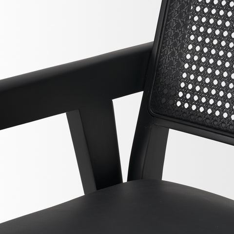 Black office chair with perforated backrest on a white background