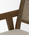 Close-up of a wooden chair with a woven backrest on a white background