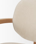 Close-up of a beige upholstered chair with wooden armrests on a white background