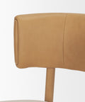 Close-up of a brown leather chair backrest on a white background