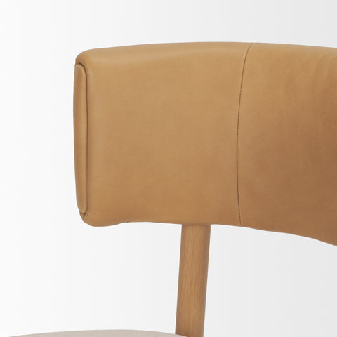Close-up of a brown leather chair backrest on a white background