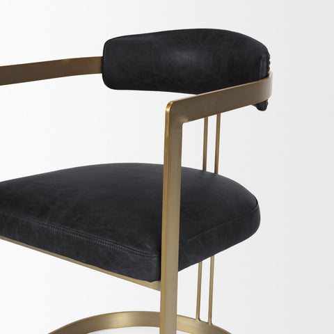 Black chair with gold frame on a white background
