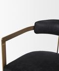 Black leather chair with gold frame on a white background