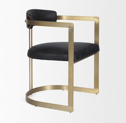 Chair with black cushioned seat and backrest on a gold metal frame against a white background