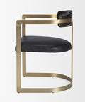 Chair with black leather seat and backrest on a gold frame against a white background