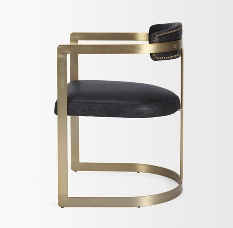 Chair with black leather seat and backrest on a gold frame against a white background