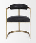 Black leather chair with gold metal frame on a white background