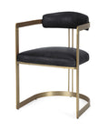 Black cushioned chair with gold metal frame on a white background