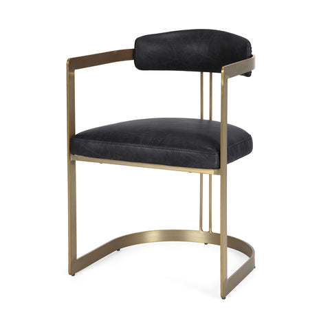 Black cushioned chair with gold metal frame on a white background