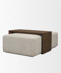 Coffee table with wooden top and beige upholstered base on a white background