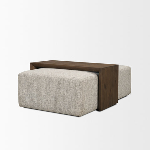Coffee table with wooden top and beige upholstered base on a white background