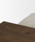 Close-up of a wooden surface with a textured gray fabric background