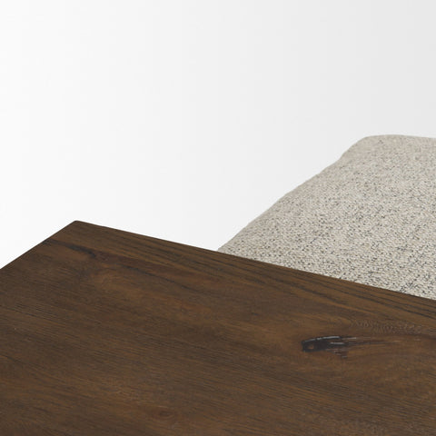 Close-up of a wooden surface with a textured gray fabric background